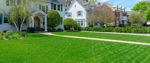 Vibrant lawn and a walkway in front of a house in Ada, MI.